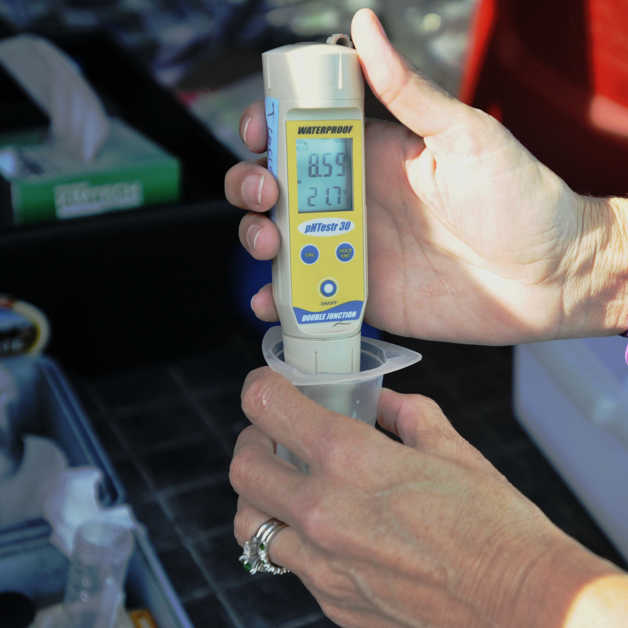 Sam Miller, Aquatic Analytics owner, tests for potential for hydrogen (pH) and chlorine in a water sample at Shaw Air Force Base, South Carolina, Oct. 17, 2017. The 20th Aerospace Medicine Squadron bioenvironmental engineering flight (BEE) contracts an outside agency to perform state mandated water quality tests, while BEE performs Air Force mandated tests. BEE takes six water samples monthly to check free available chlorine and pH levels as well as perform bacteriological tests. (U.S. Air Force photo by Senior Airman Ashley Maldonado)